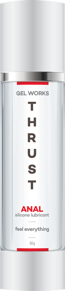 A bottle of Gel Works Thrust Anal Silicone lubricant with a white and red label, indicating it is a product for intimate use with a smooth texture.