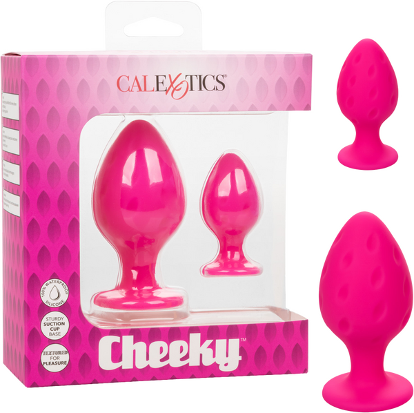 The image shows the Cheeky™ Anal Plugs in pink, including two sizes of the product (large and small) displayed both inside and outside of the packaging.