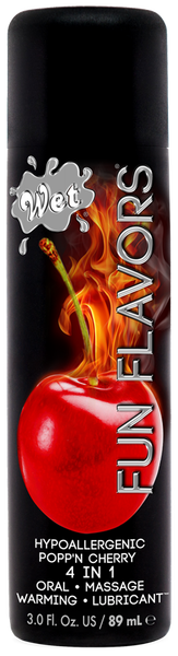 A bottle of Wet Fun Flavors Warming Lubricant with a red label, displaying various flavors such as Watermelon, Cherry, Strawberry, and Passion Punch.